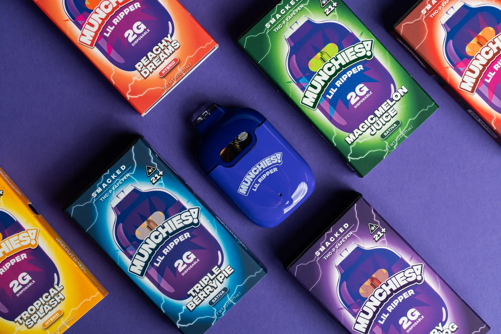 Lil Ripper vapes on a spread of flavor boxes